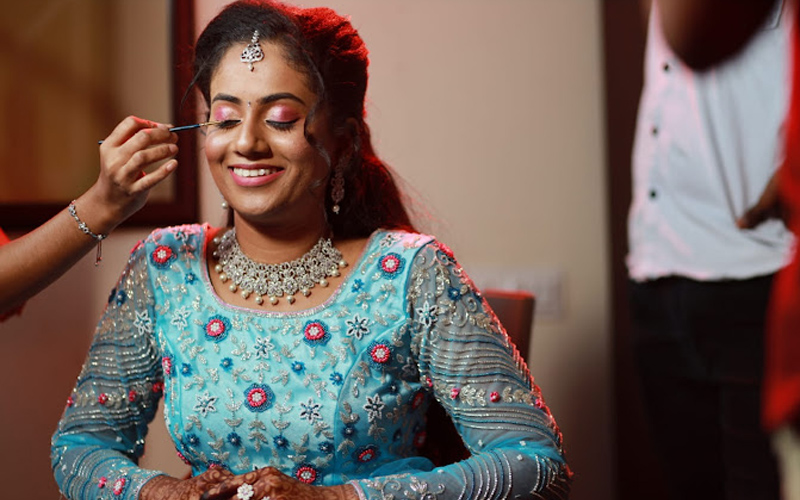 Professional hairstyling and makeup services in-parlor, offering personalized looks for every occasion, from casual to glamorous.
